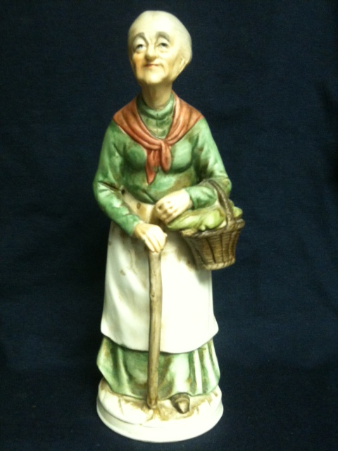 Old Woman Carrying Basket of Corn